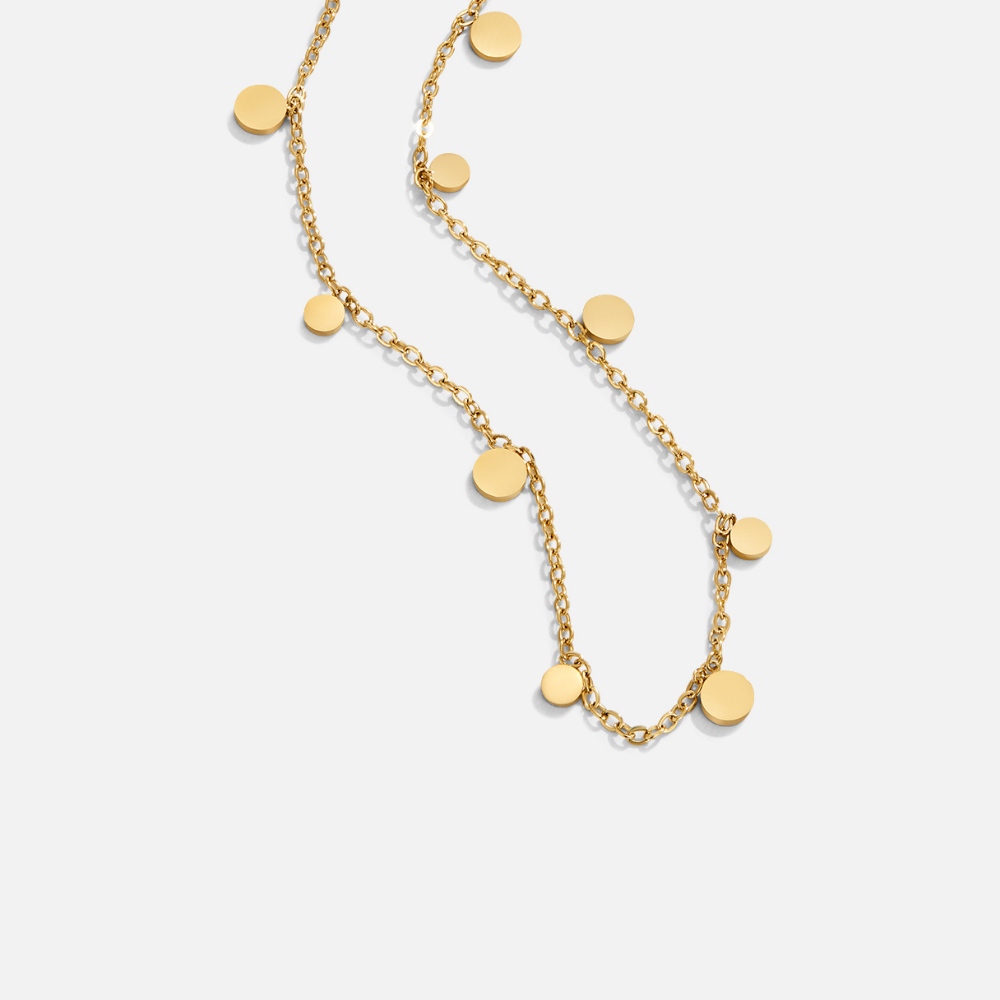 Agatha Gold Droplet Necklace, gold chain necklace laid flat with round disc charms along its length