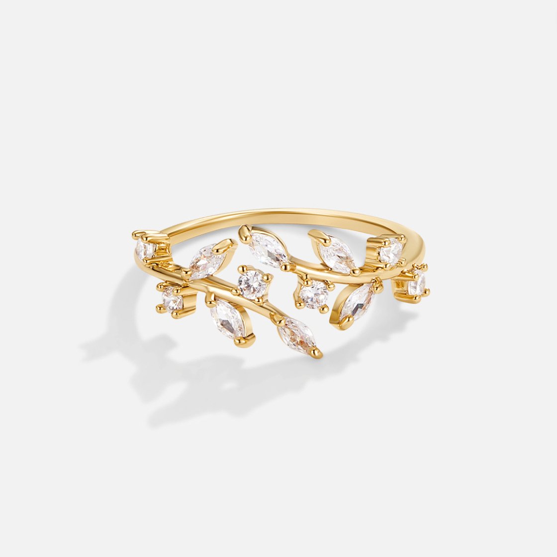 18K Gold Crystal Vine Ring, gold ring with crystal leaves on a vine, on a plain white background