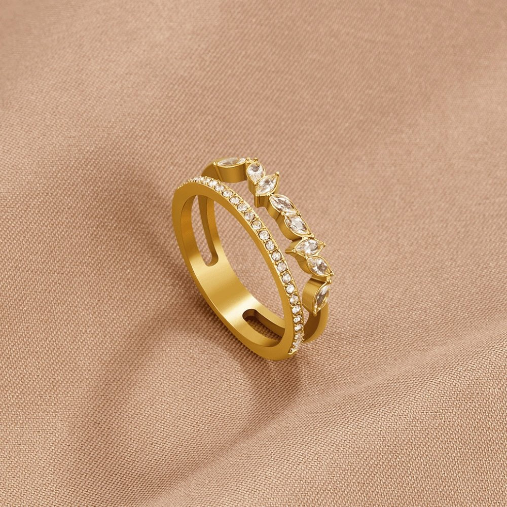 18K Gold Mia Crystal Ring, gold ring on beige fabric, pavΓ© band and marquise stones