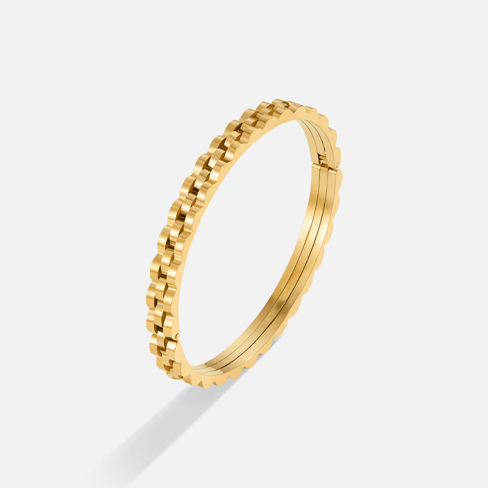 Renee Chunky Gold Bangle, standing upright on a white background, gold link-textured bangle