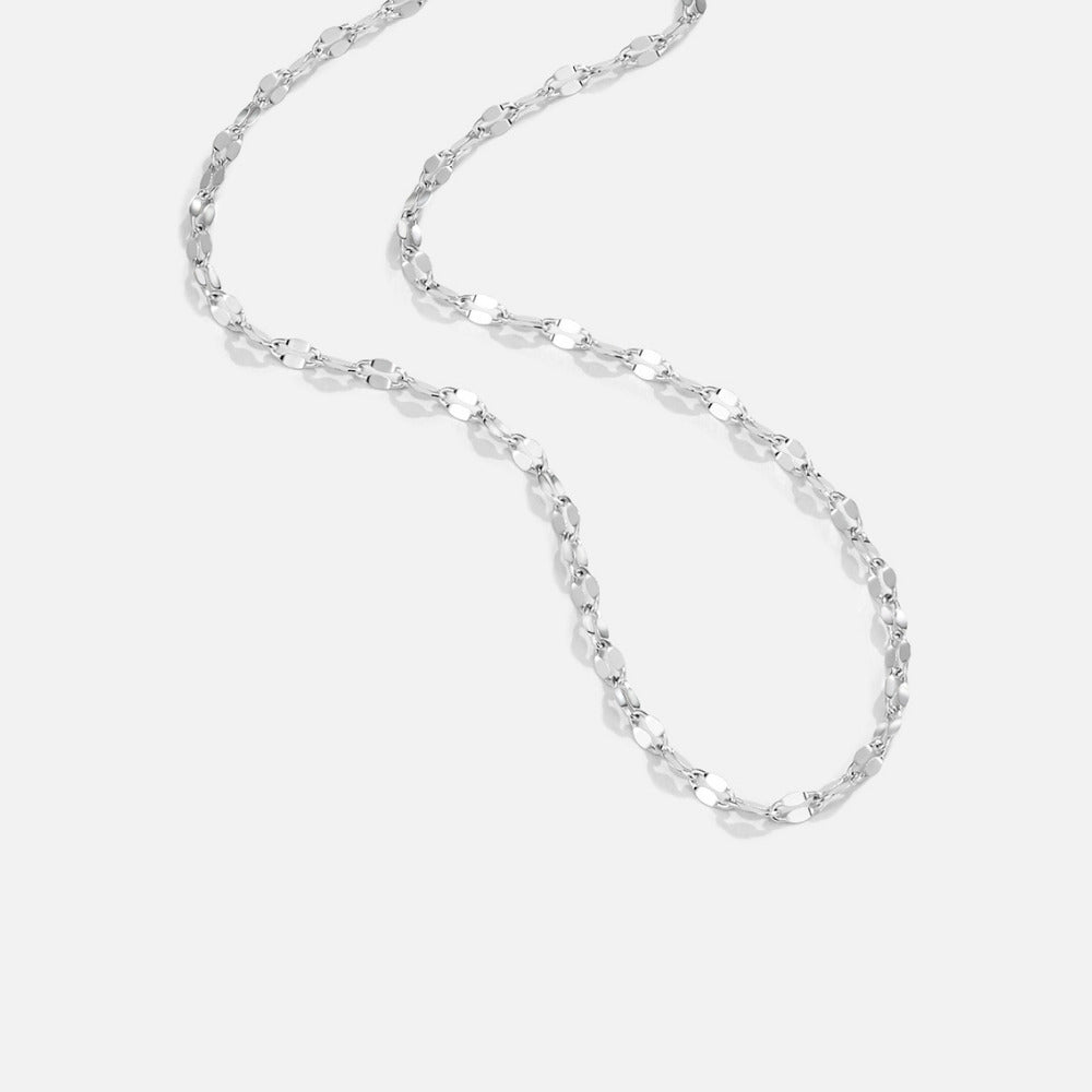 Leila Silver Chain Necklace, silver chain laid loosely on a plain white background, flat-link design