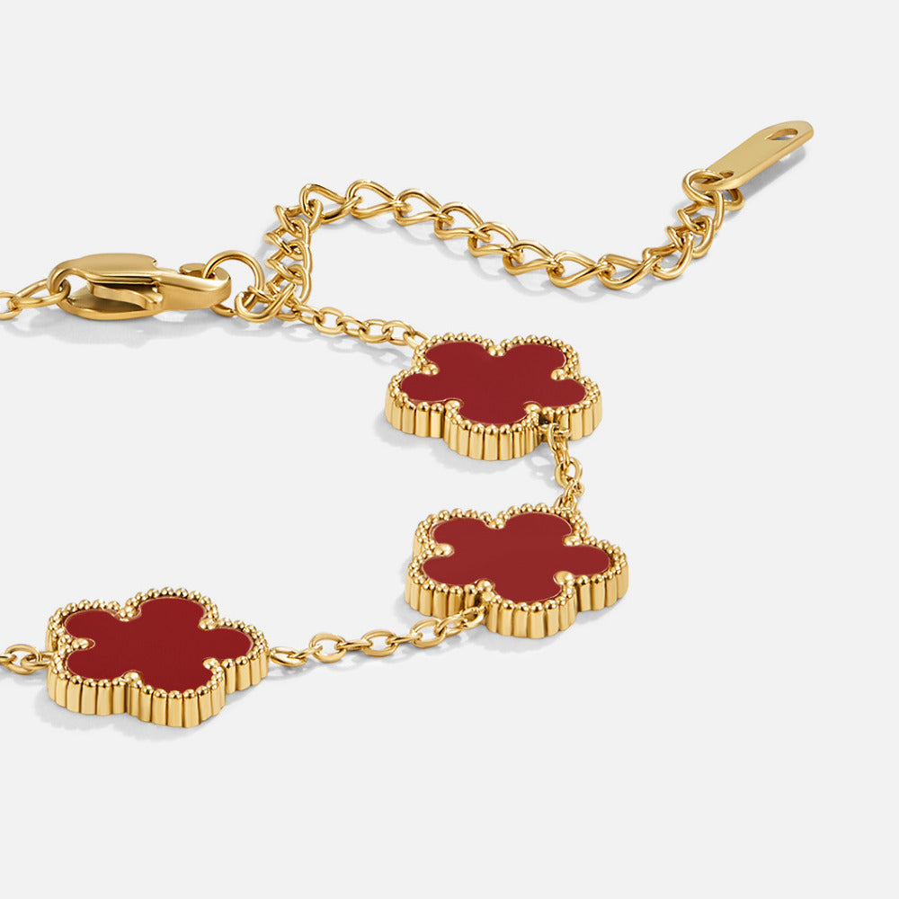 Lucky Red Clover Leaf Bracelet, close-up of gold chain with red clover motifs and lobster clasp