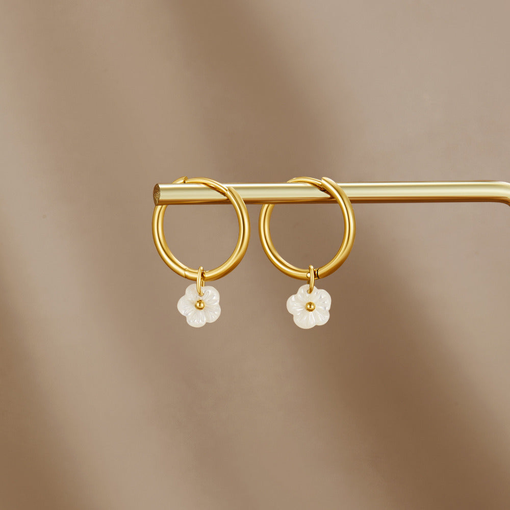 White Petal Shell Hoop Earrings, pair of gold hoops hung on a gold bar, with white flower charms