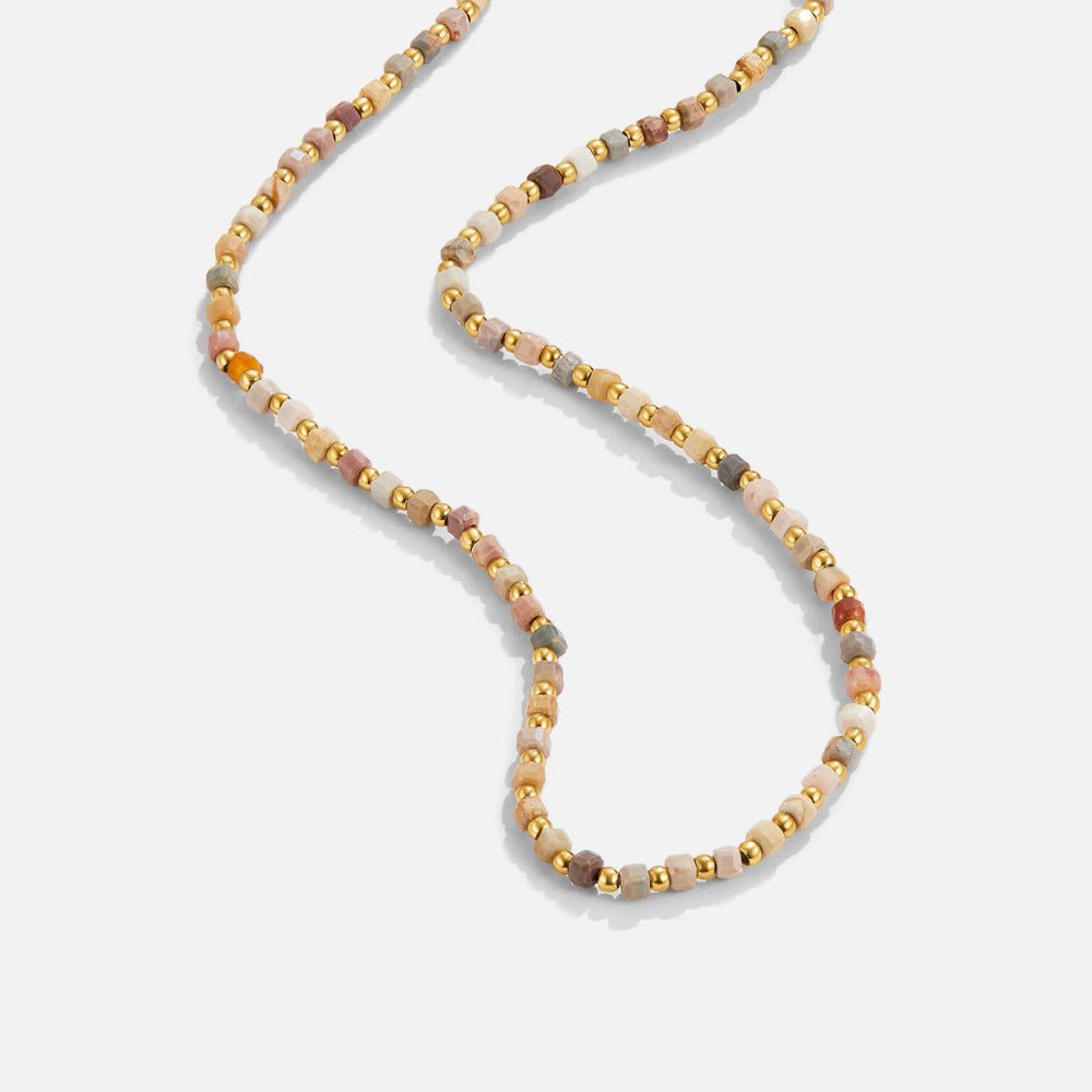 Alashan Stone Bead Necklace, laid out on white, beaded with multicoloured stones and gold