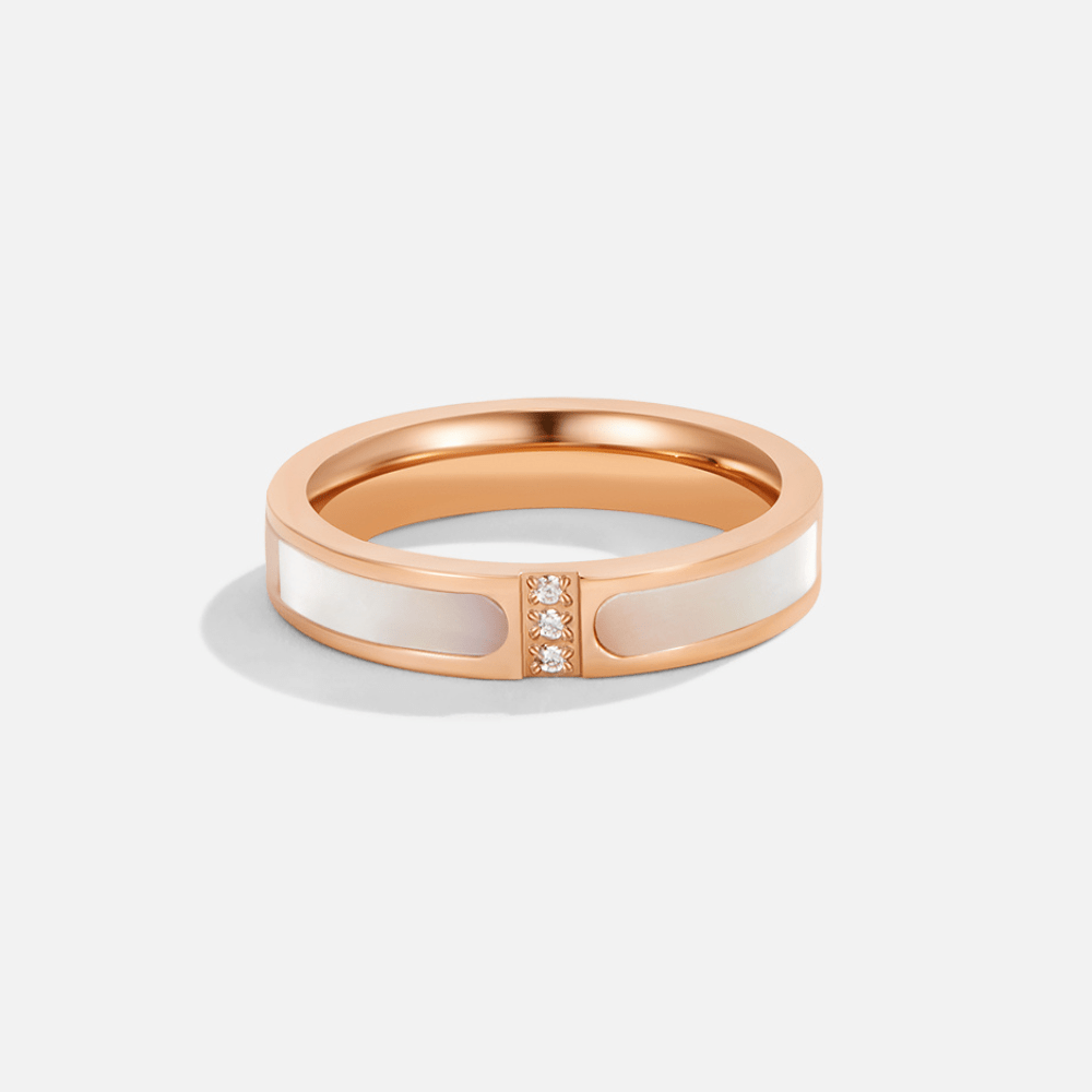 Alona Mother Of Pearl Ring, rose gold band with white inlays and three small stones at centre
