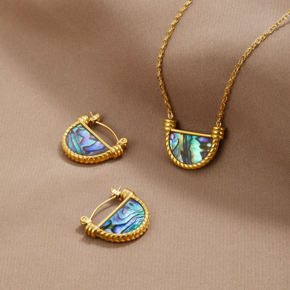 Amalfi Turquoise Jewelry Set, pair of hoop earrings and a pendant necklace on beige fabric