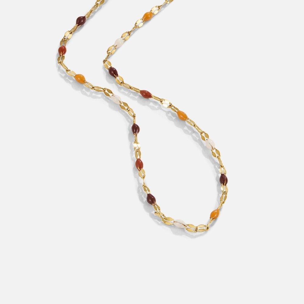 Aurora Stone Bead Necklace, gold chain necklace with brown, orange and cream beads, laid flat