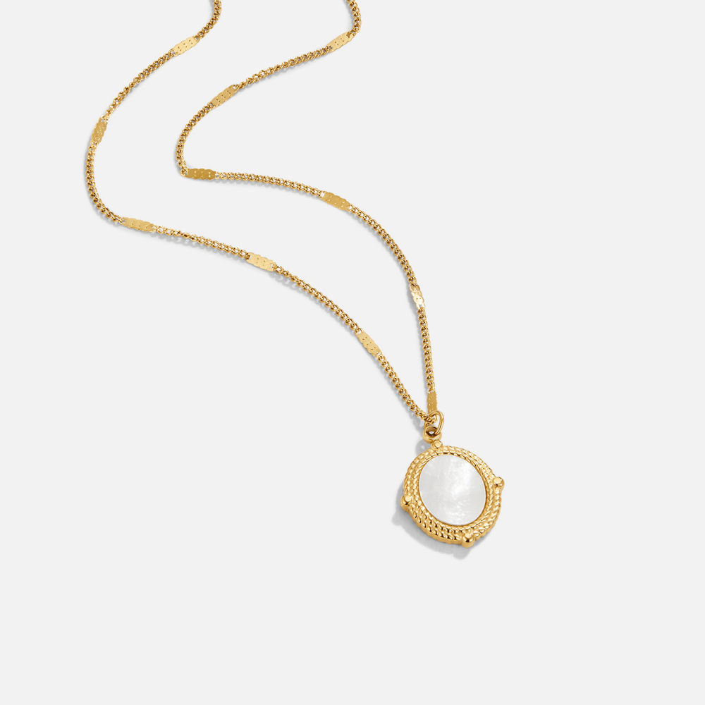 Bela Pearl Shell Pendant Necklace, laid flat on white, gold chain with round white shell pendant
