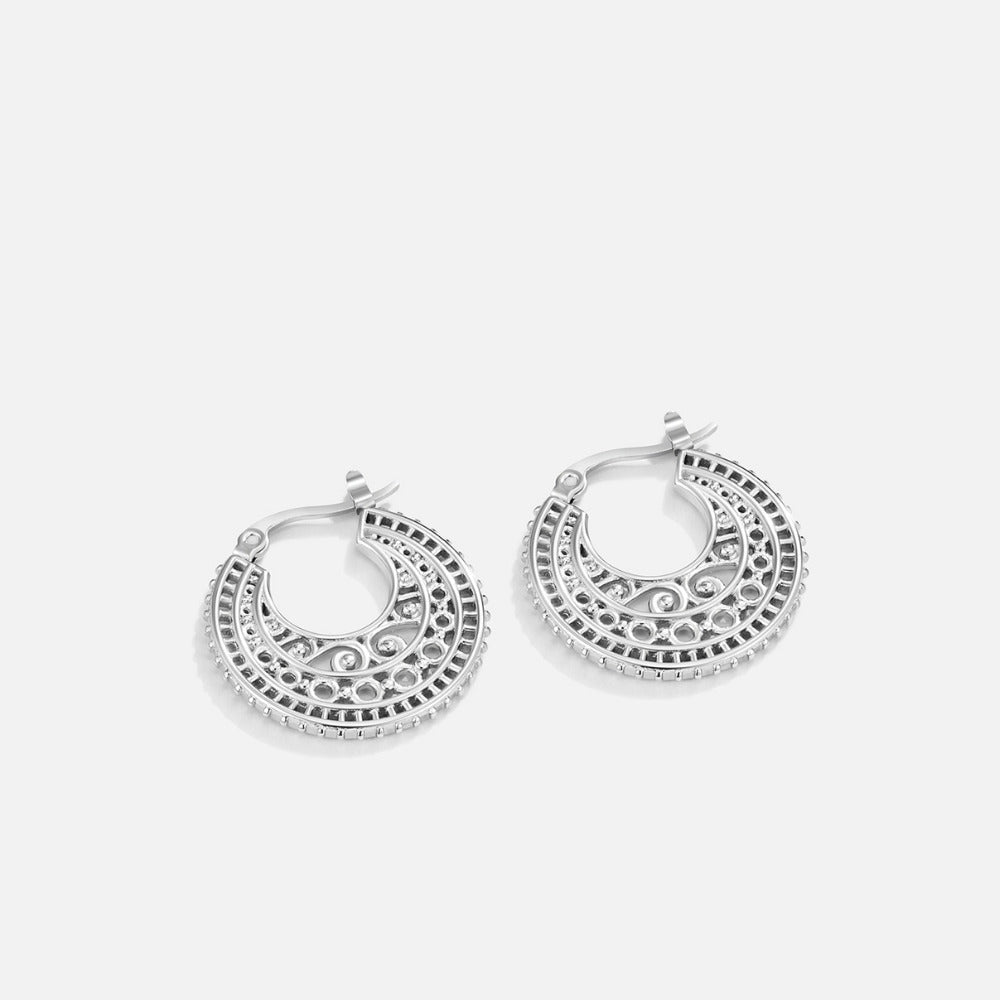 Boho Chic Silver Hoop Earrings, pair of silver hoop earrings on plain light background