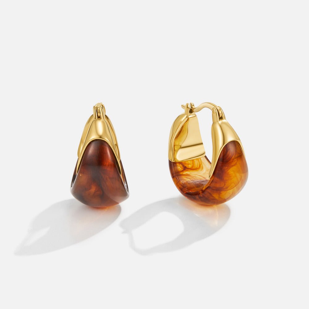 Brown Tahiti Hoop Earrings, a pair of hoop earrings on a white background, gold with amber resin