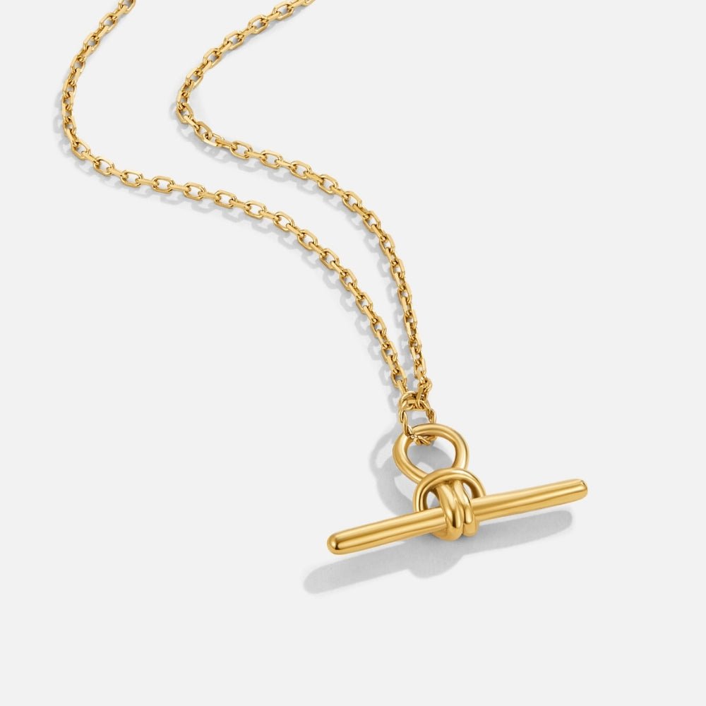 Cassy Toggle Pendant Necklace, gold chain necklace with a knotted T-bar pendant on white