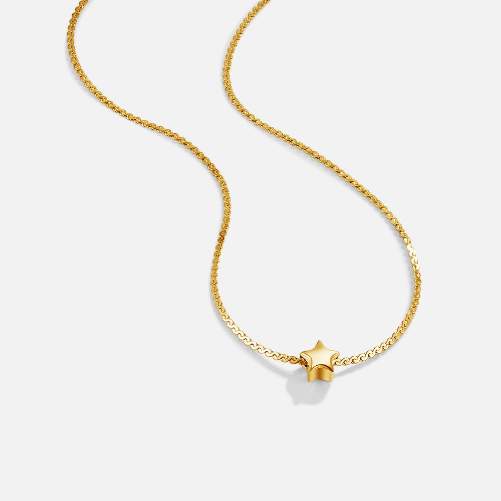 Dainty Star Pendant Gold Necklace, laid out on white, small gold star pendant on a fine chain