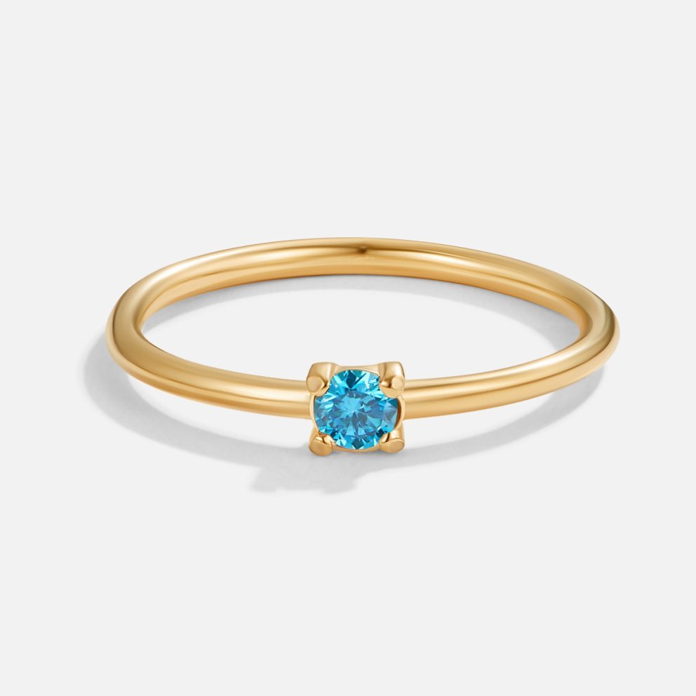 December Birthstone 18K Gold Ring, thin gold band with small blue stone in four-prong setting