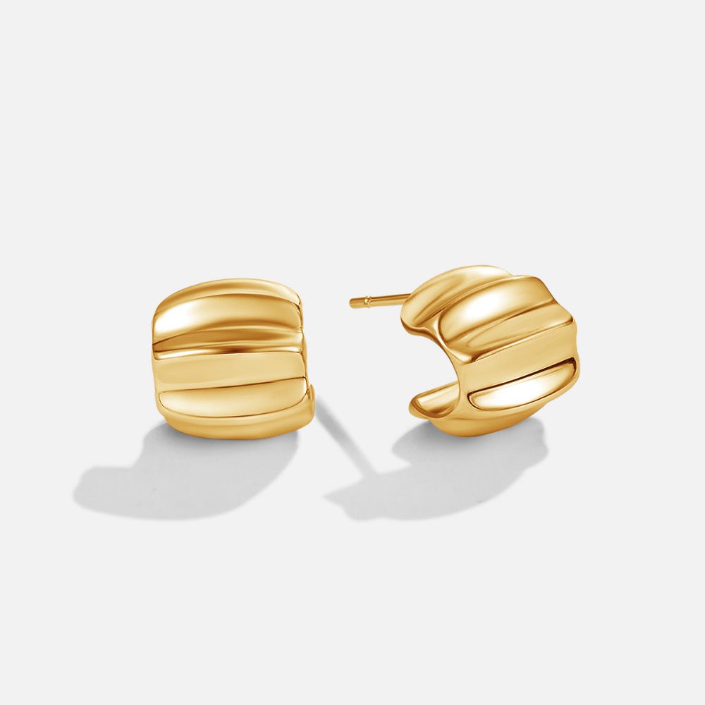 Elsa Mini Wave Hoop Earrings, pair of gold earrings on white background, ridged curved hoops