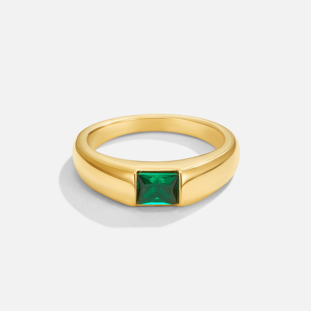 Ember Gold & Emerald Ring, standing alone on white, gold band with square green stone