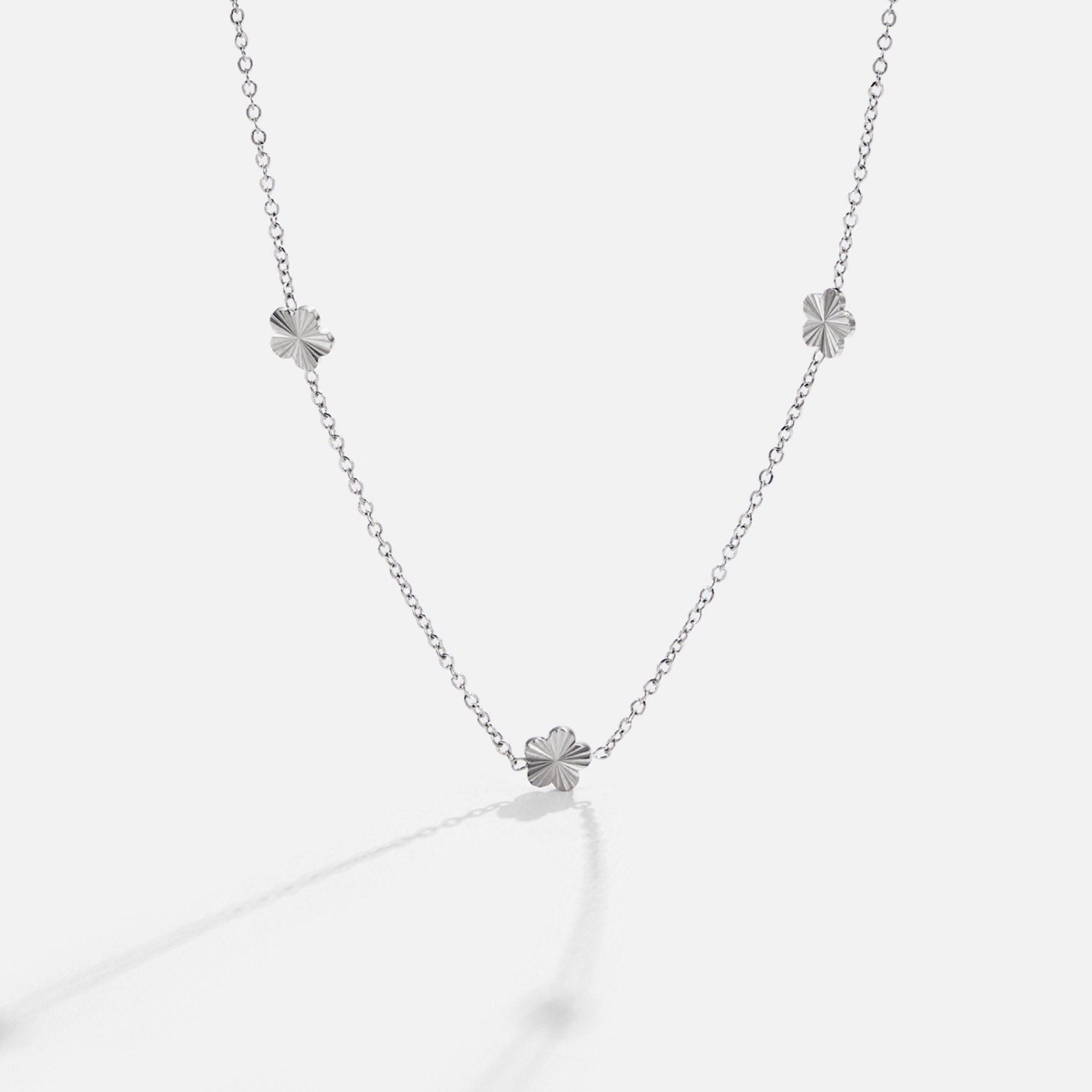 Flower Power Silver Chain Necklace, silver chain necklace laid flat with three textured flower