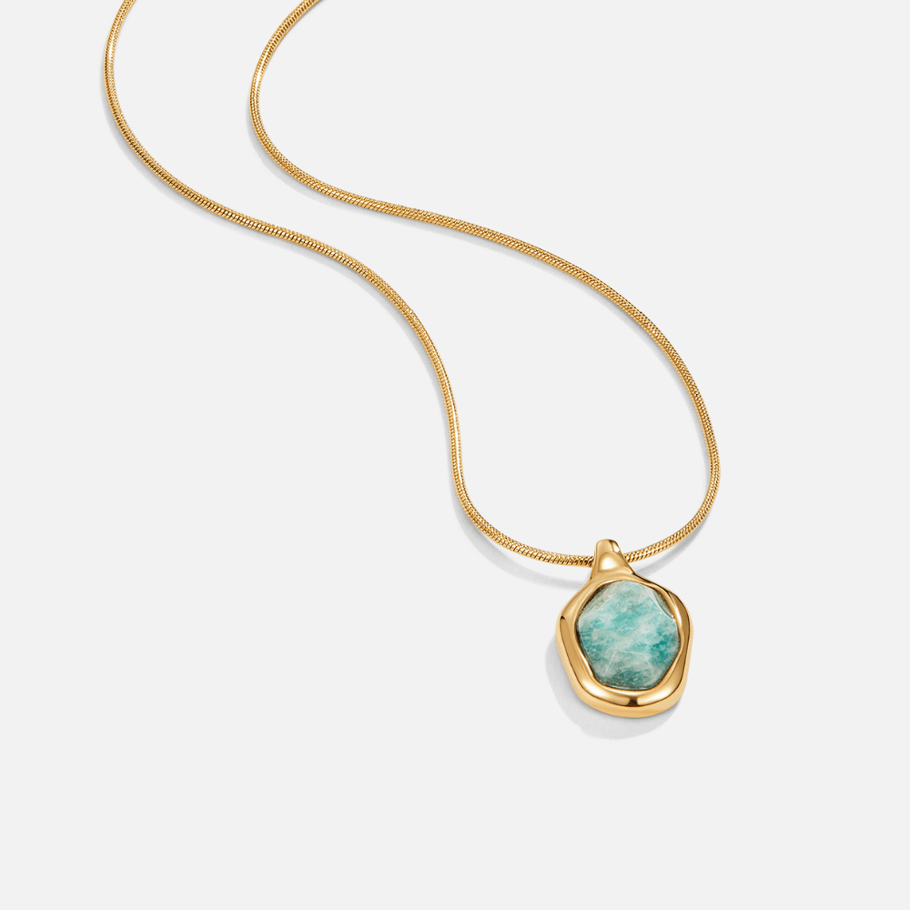 Gold Aquamarine Pendant Necklace, flat-lay on white, gold chain with teal stone pendant