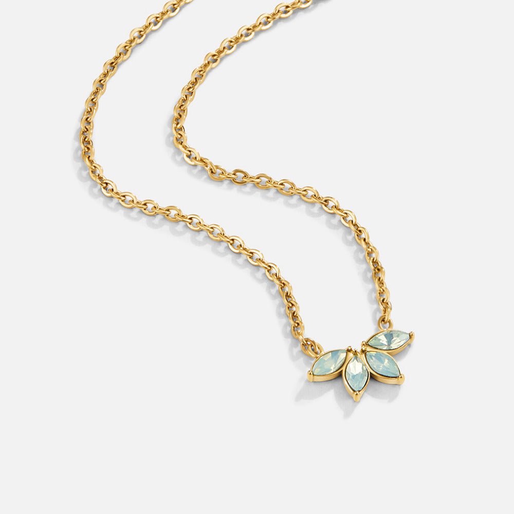 Gold Marquise Petal Necklace, laid flat on white, gold chain with pale blue marquise-stone