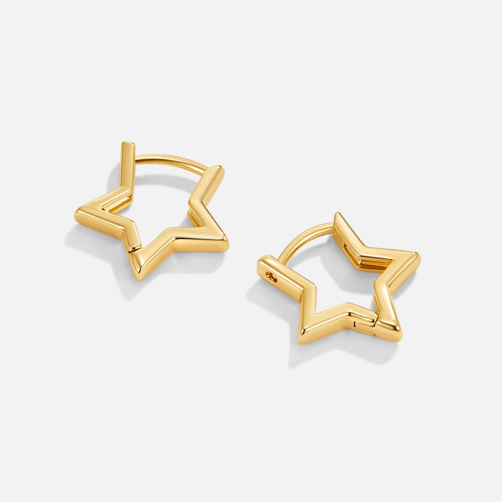 Gold Star Hoop Earrings, a pair of star-shaped gold hoop earrings lying flat on white