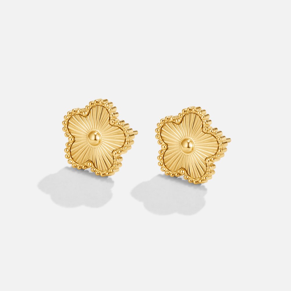 Golden Clover Earrings, pair of gold stud earrings on white, flat-lay with shadows