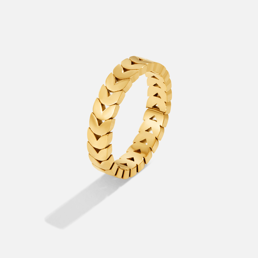 Golden Olive Leaf Ring, standing upright on a light background, gold ring with chevron links