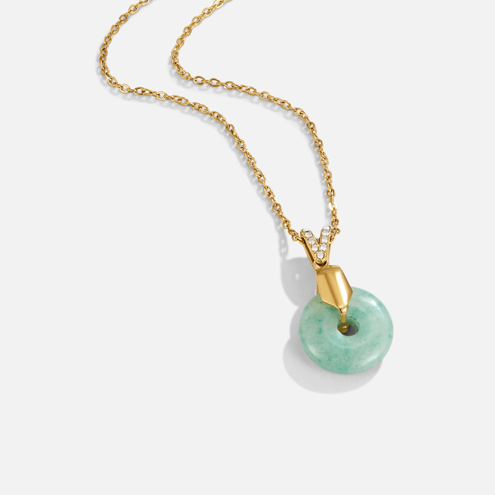 'Goodluck' Jade Pendant Necklace, gold chain necklace with a green jade donut pendant on white
