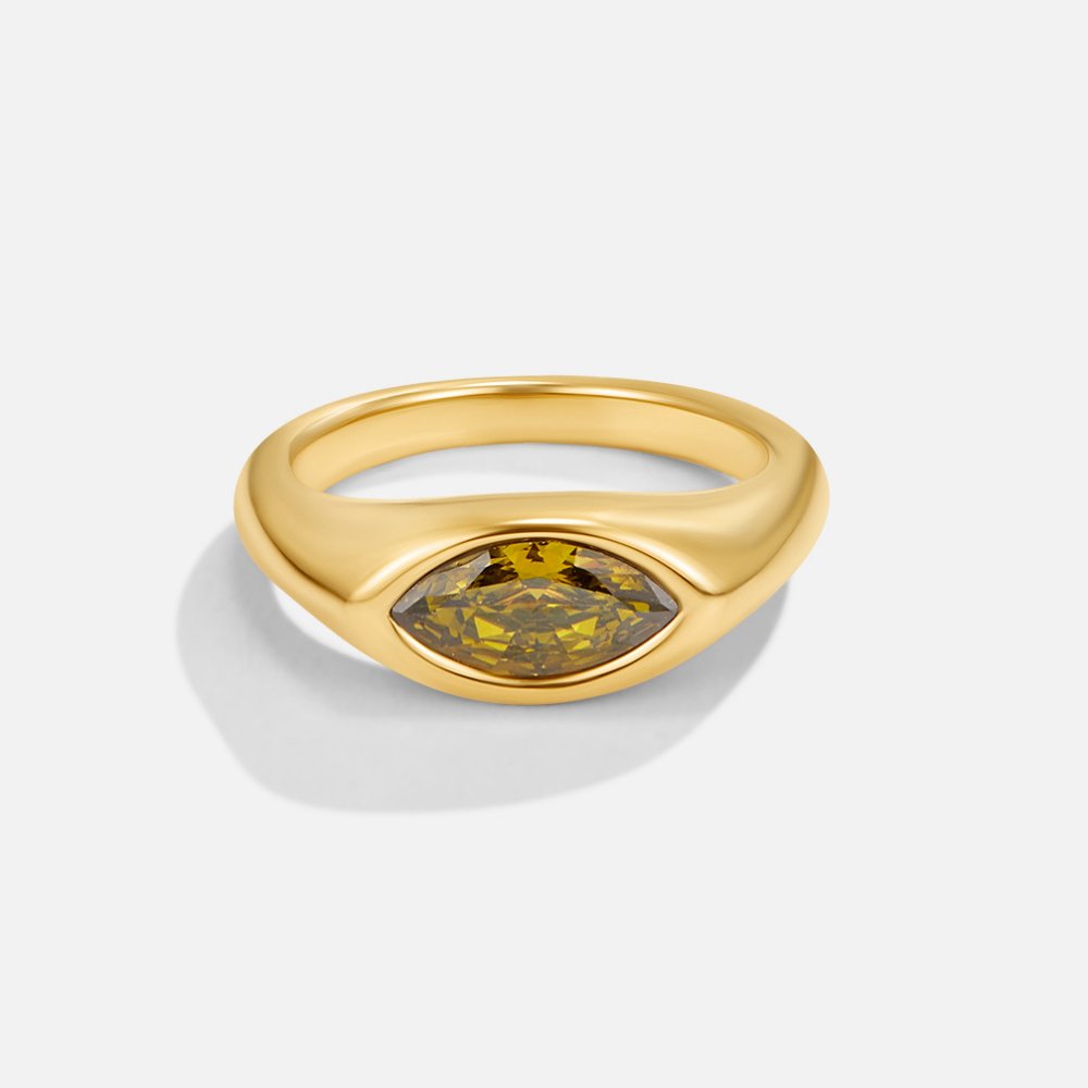 Green Arizona Crystal Ring, gold ring with a marquise olive-green stone set horizontally, on white
