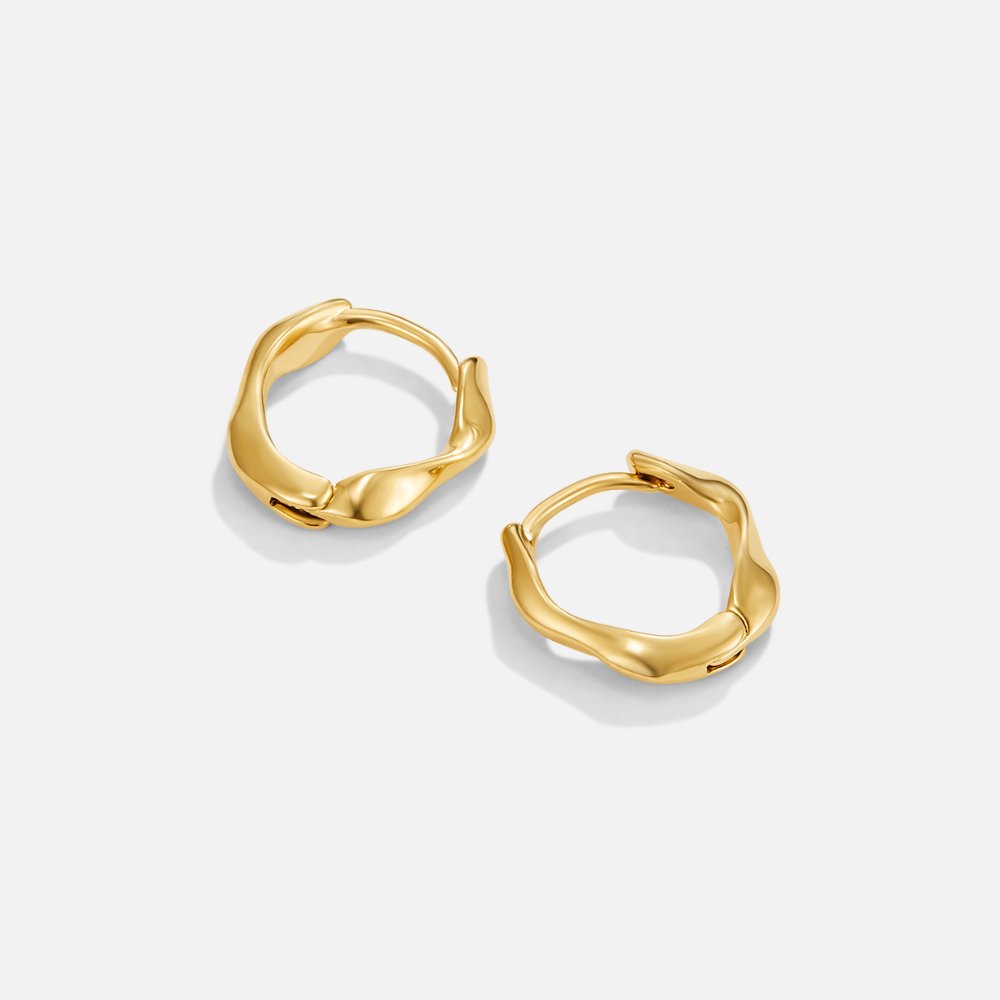 Lala Twisted Hoop Earrings, pair of gold hoops with wavy, twisted edges on white background