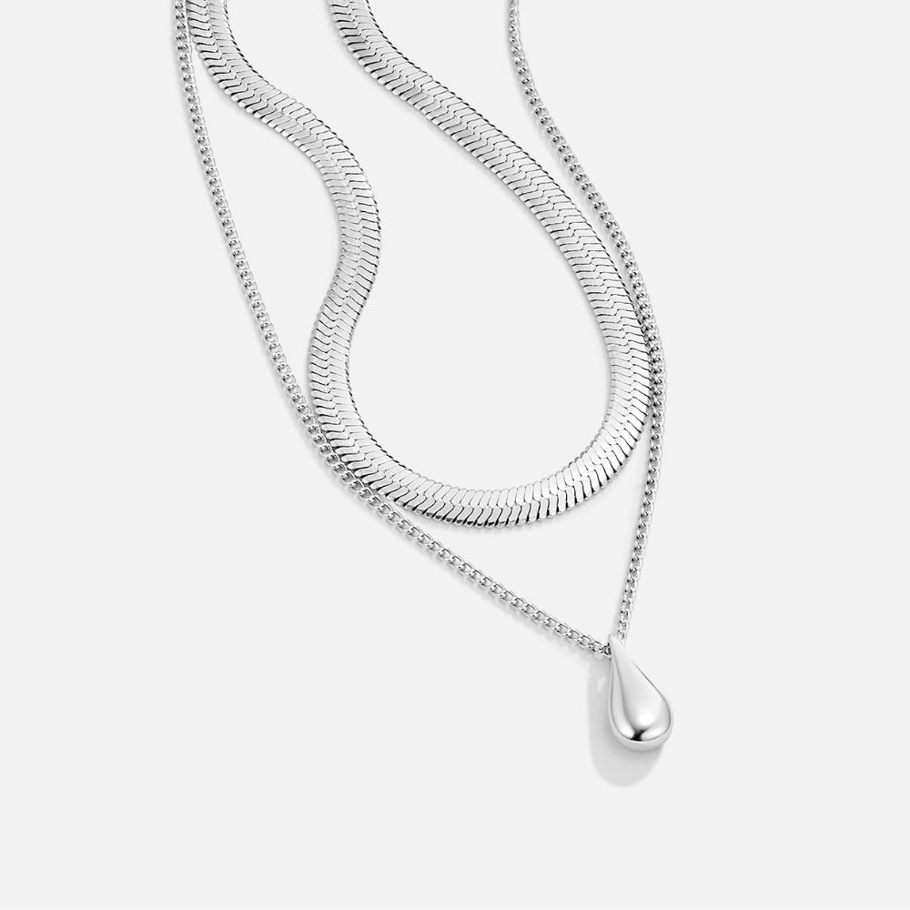Layered Silver Bella Teardrop Necklace, two silver chains on white, with teardrop pendant at