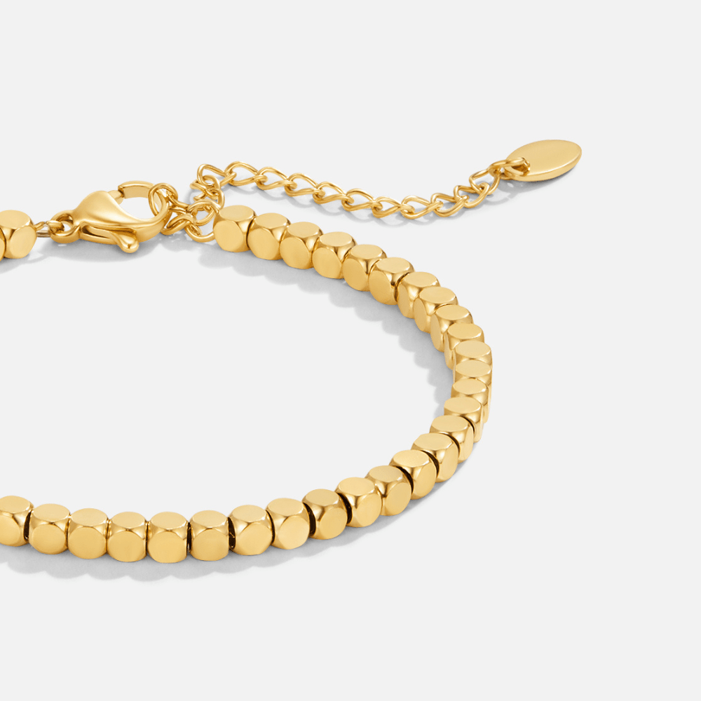 Lexi 18K Gold Cube Bracelet, laid flat, gold cube beads with lobster clasp and extender chain