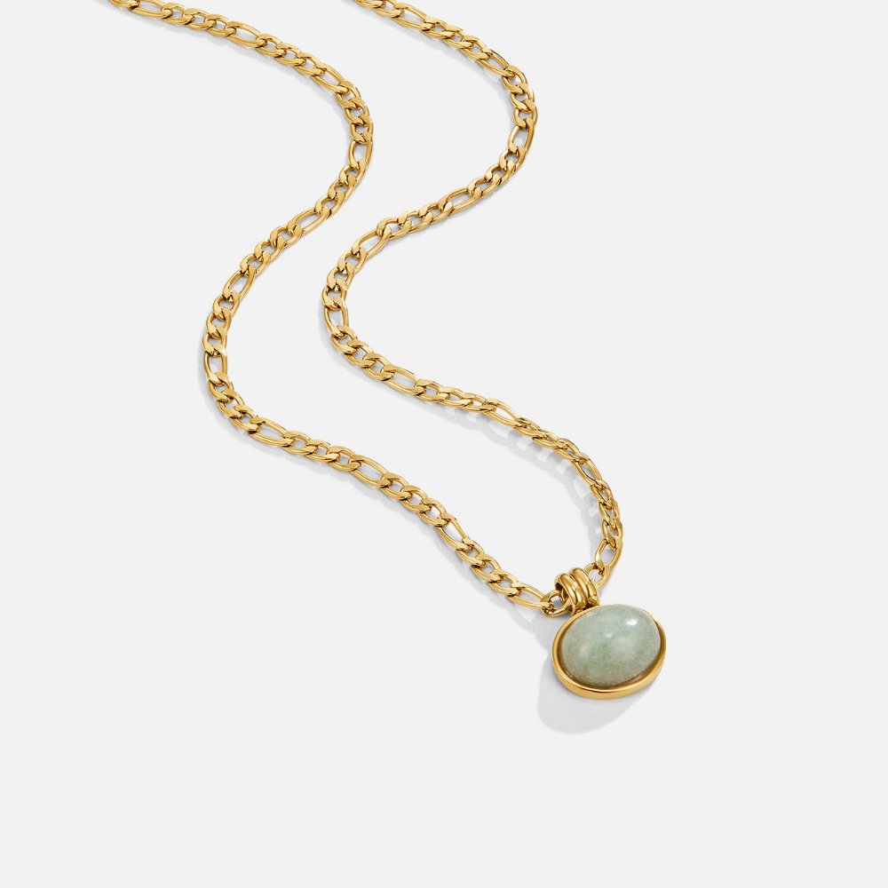Liza Jade Pendant Necklace, gold figaro chain necklace laid flat on white, round green stone pendant