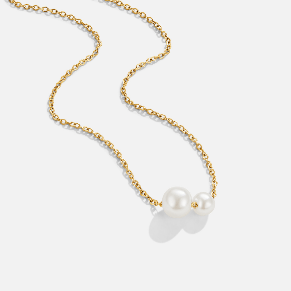 Louise Double Pearl Pendant Necklace, gold chain necklace laid flat with two pearls at the centre