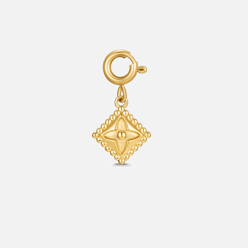 Lucky Gold Clover Leaf Charm, gold charm on a plain light background, with a spring clasp at the top