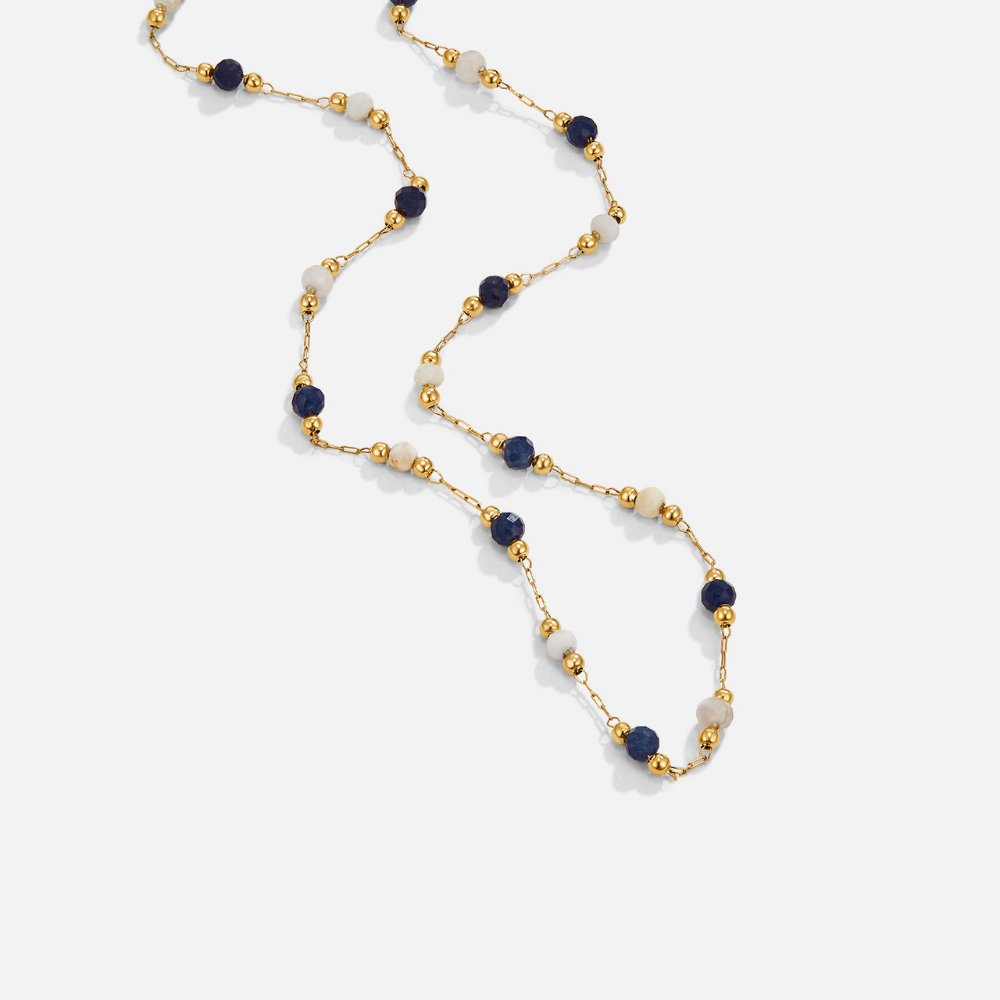 Lulu Midnight Beaded Stone Necklace, flat lay of a gold chain with navy and cream beads