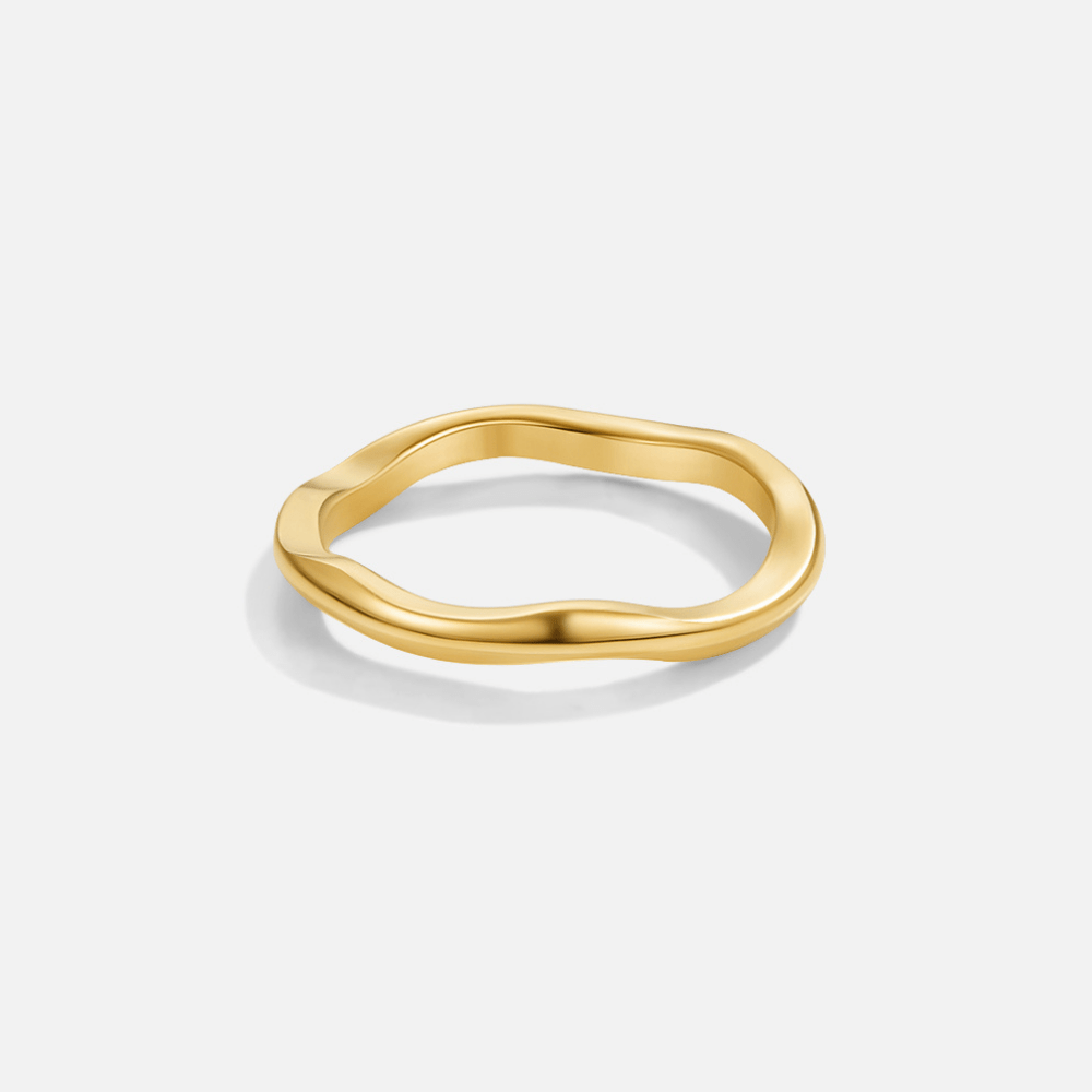 Madison Thin Wave Ring, polished gold ring with a wavy band on a plain background