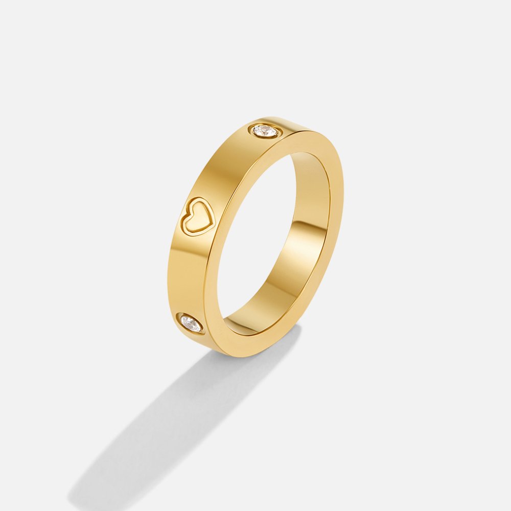 Mari Heart Gold Ring, standing gold band on white, with heart cutouts and small crystal stones