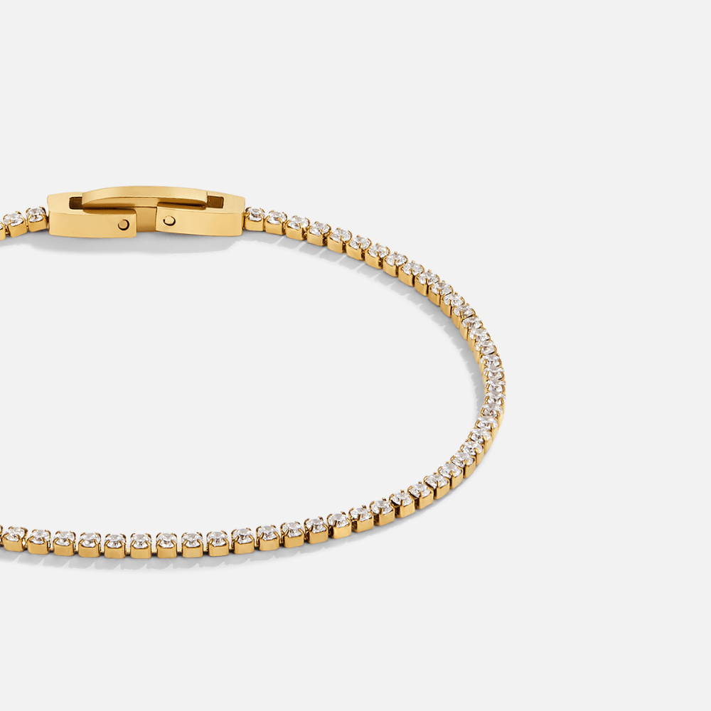 Niyah White Crystal Gold Bracelet, gold tennis bracelet with clear stones, clasp at top left