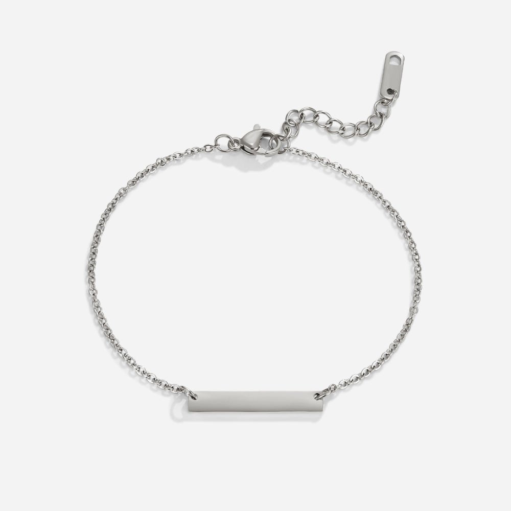 Rina Silver Bar Bracelet, flat lay of silver chain bracelet with plain bar charm and clasp