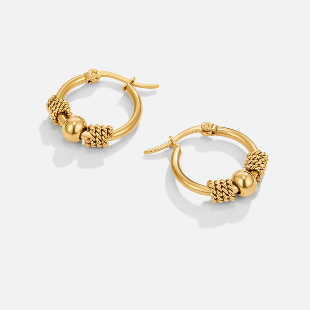 Selena Gold Hoop Earrings, pair of gold hoops on white background, twisted rope and ball beads