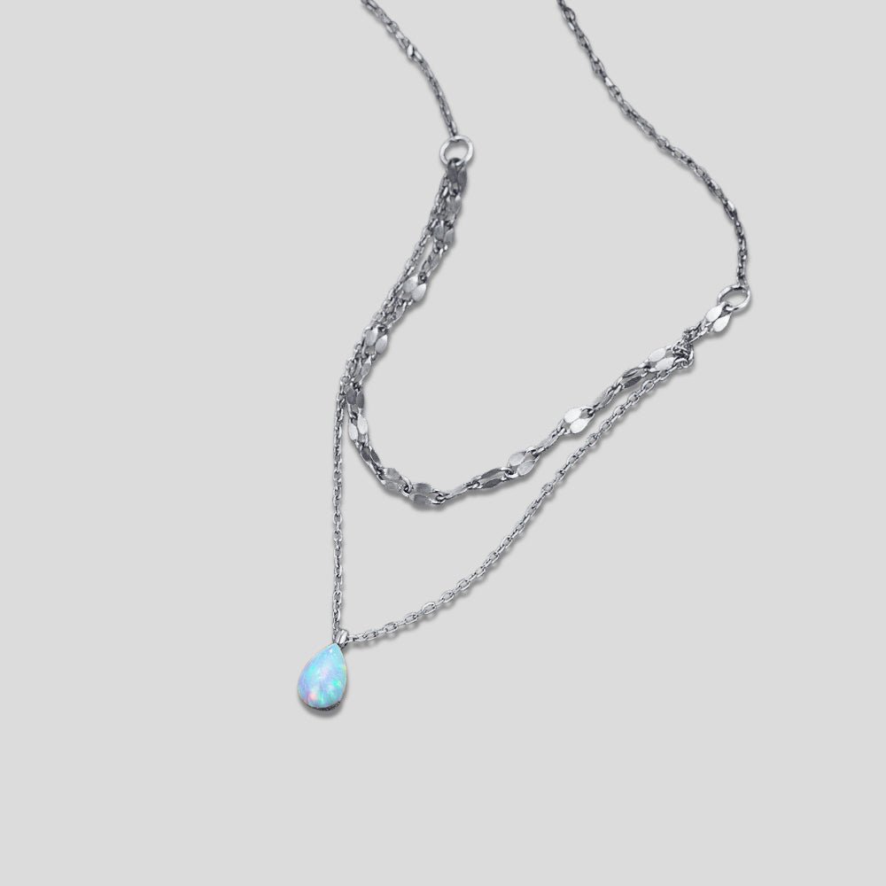 Silver Blue Opal Teardrop Layered Necklace, layered silver necklace on a plain grey
