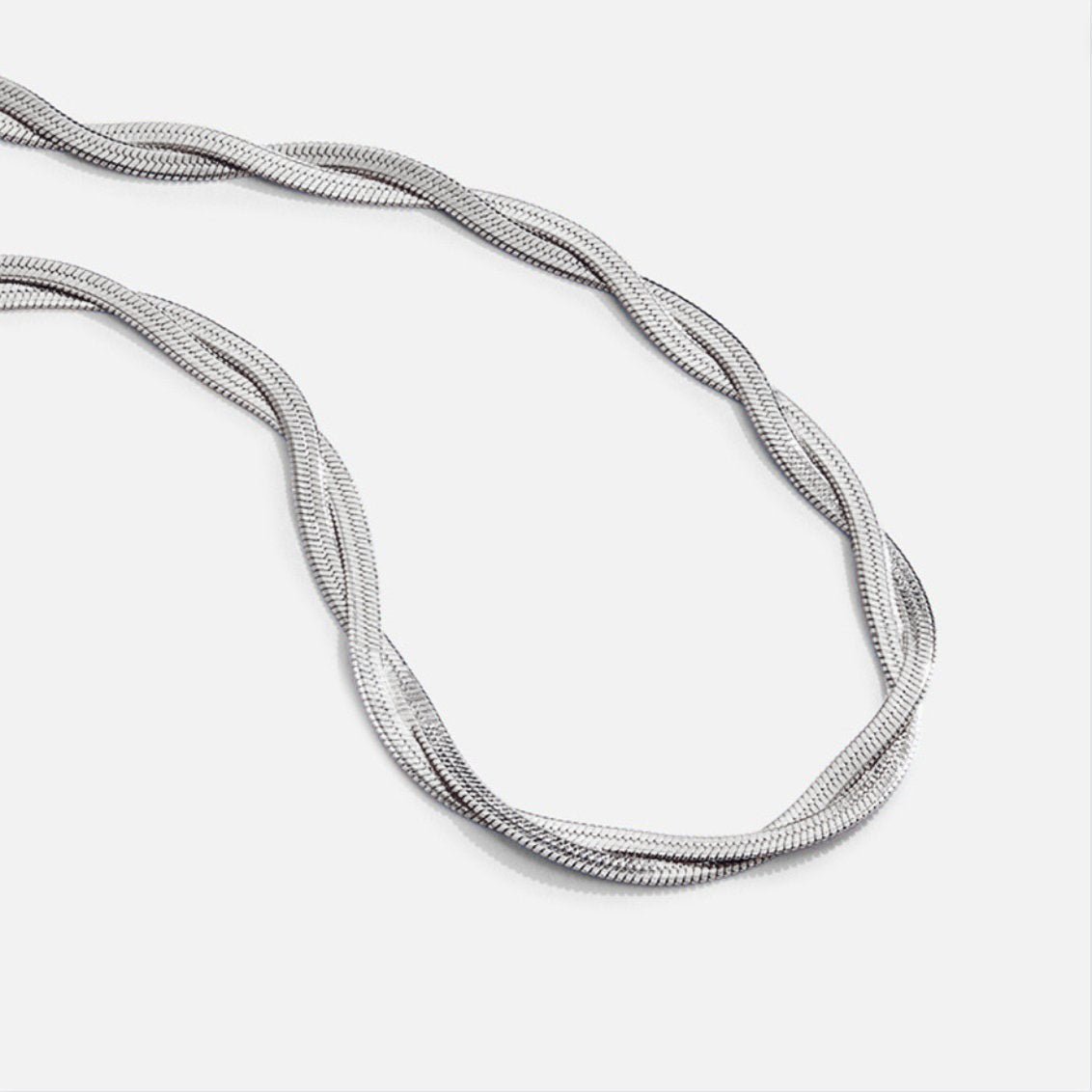 Silver Chiara Twist Snake Chain Necklace, close-up of a twisted silver chain on white
