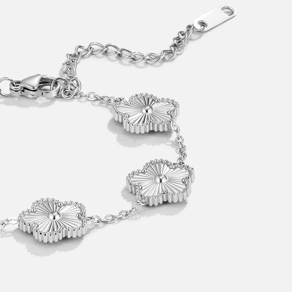 Silver Clover Bracelet, close-up of silver clover charms on a chain with clasp and extender