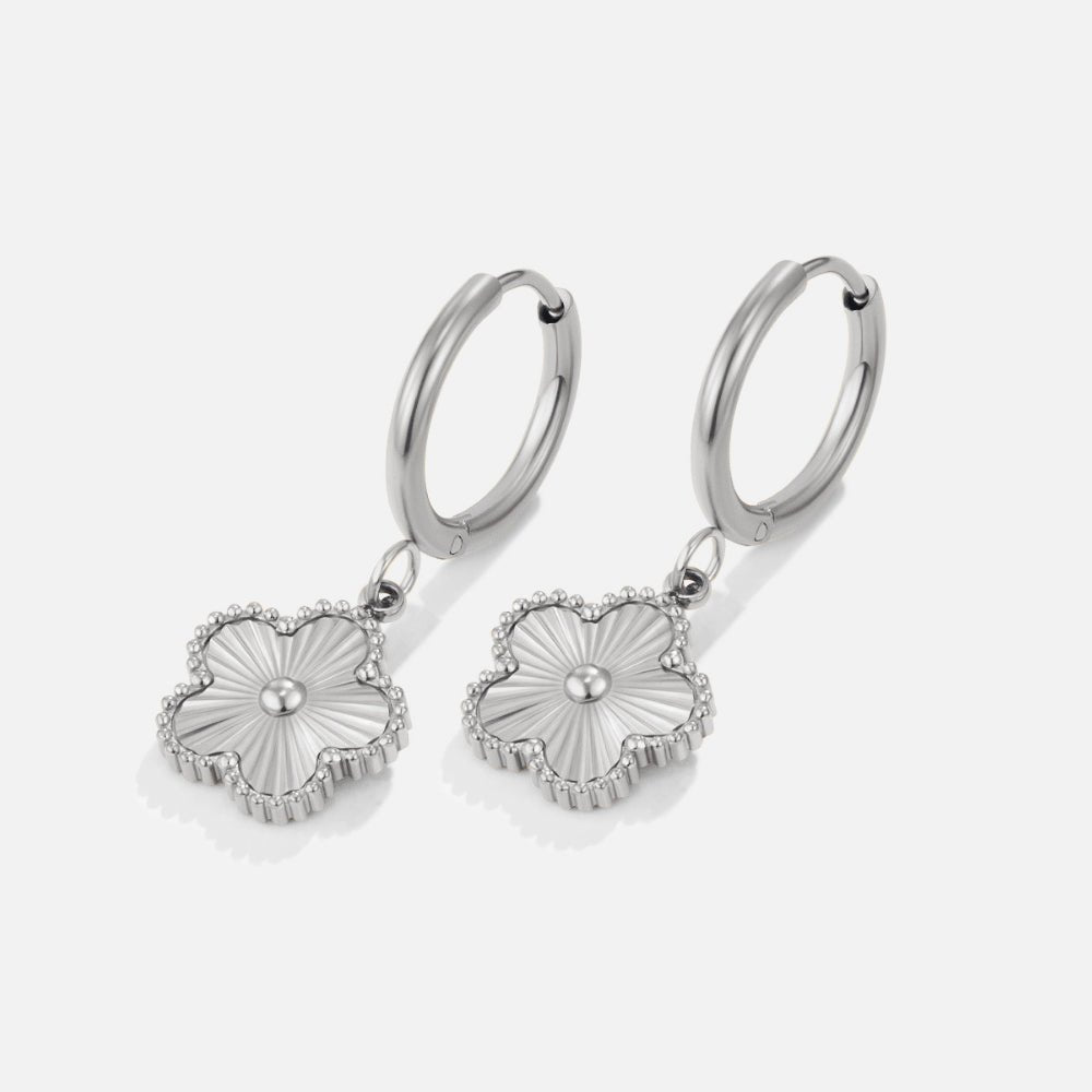 Silver Clover Hoop Earrings, pair of hoop earrings with clover charms, on white background