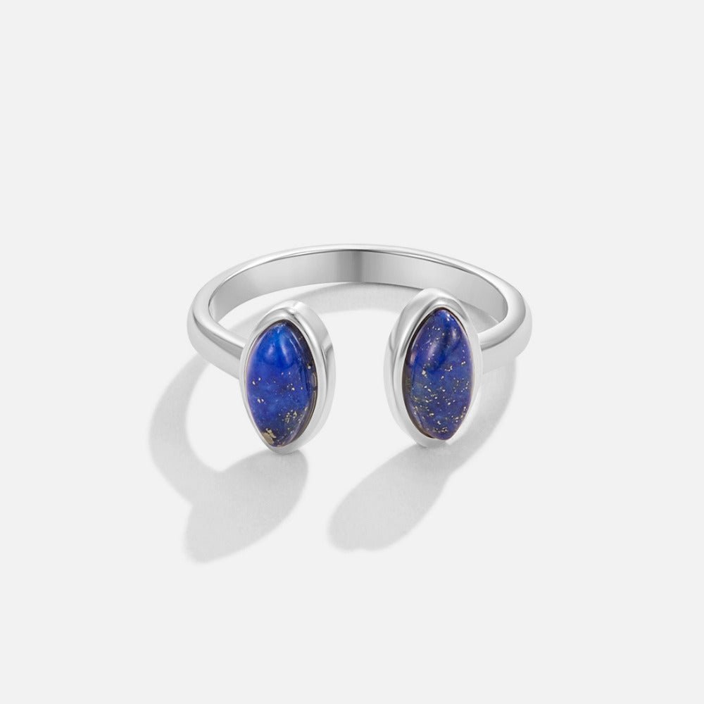 Silver Lapis Lazuli Wrap Ring, open silver band with two oval blue stones, on a plain background