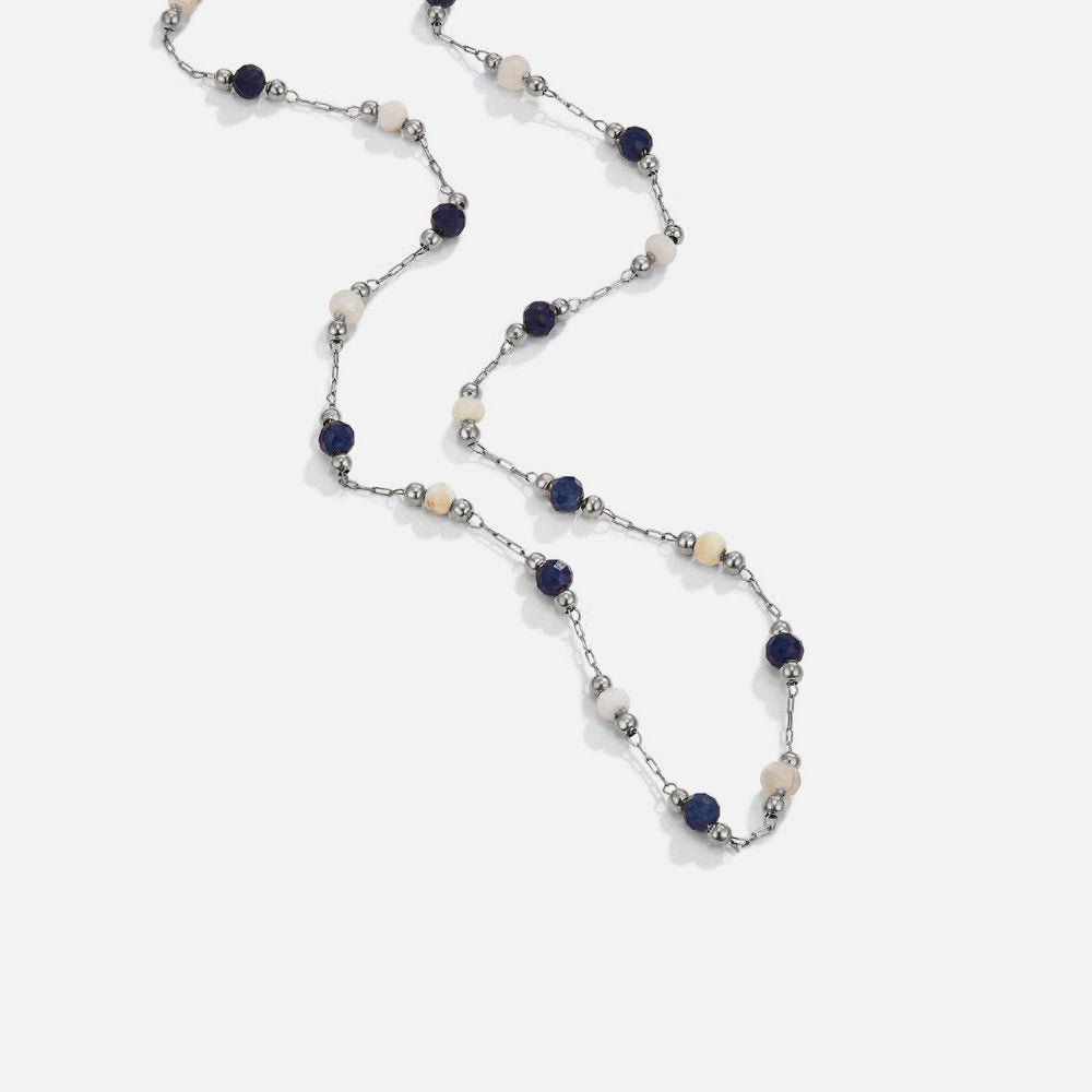 Silver Lulu Midnight Beaded Stone Necklace, laid flat on white, long chain with navy and cream
