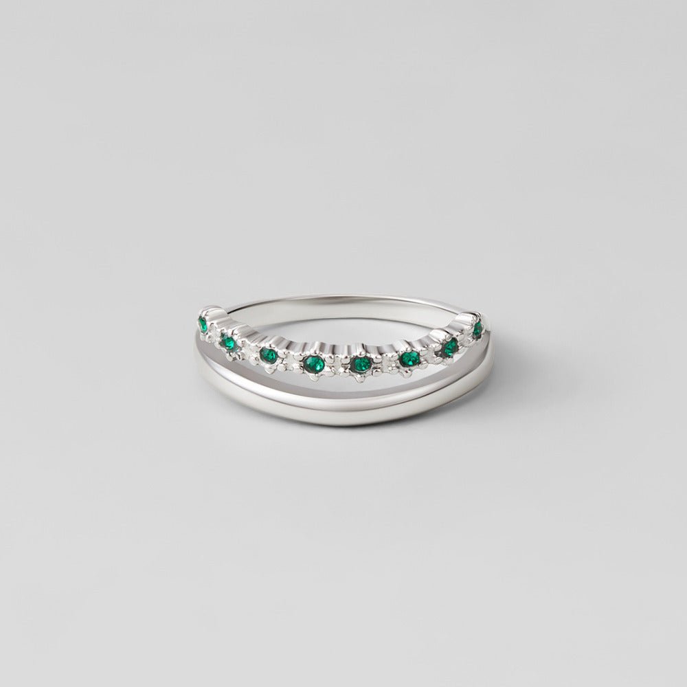 Silver Marissa Emerald Green Layered Ring, two silver bands on a grey surface, one set with
