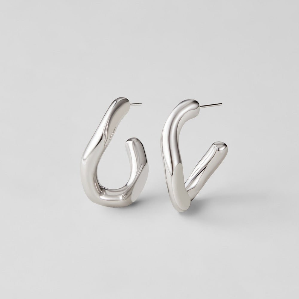 Silver Nevada Hoop Earrings, pair of polished silver open hoops on a plain grey background