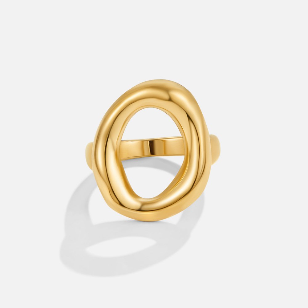 Vina Melted Gold Ring, polished gold ring with an open oval face, standing upright on white