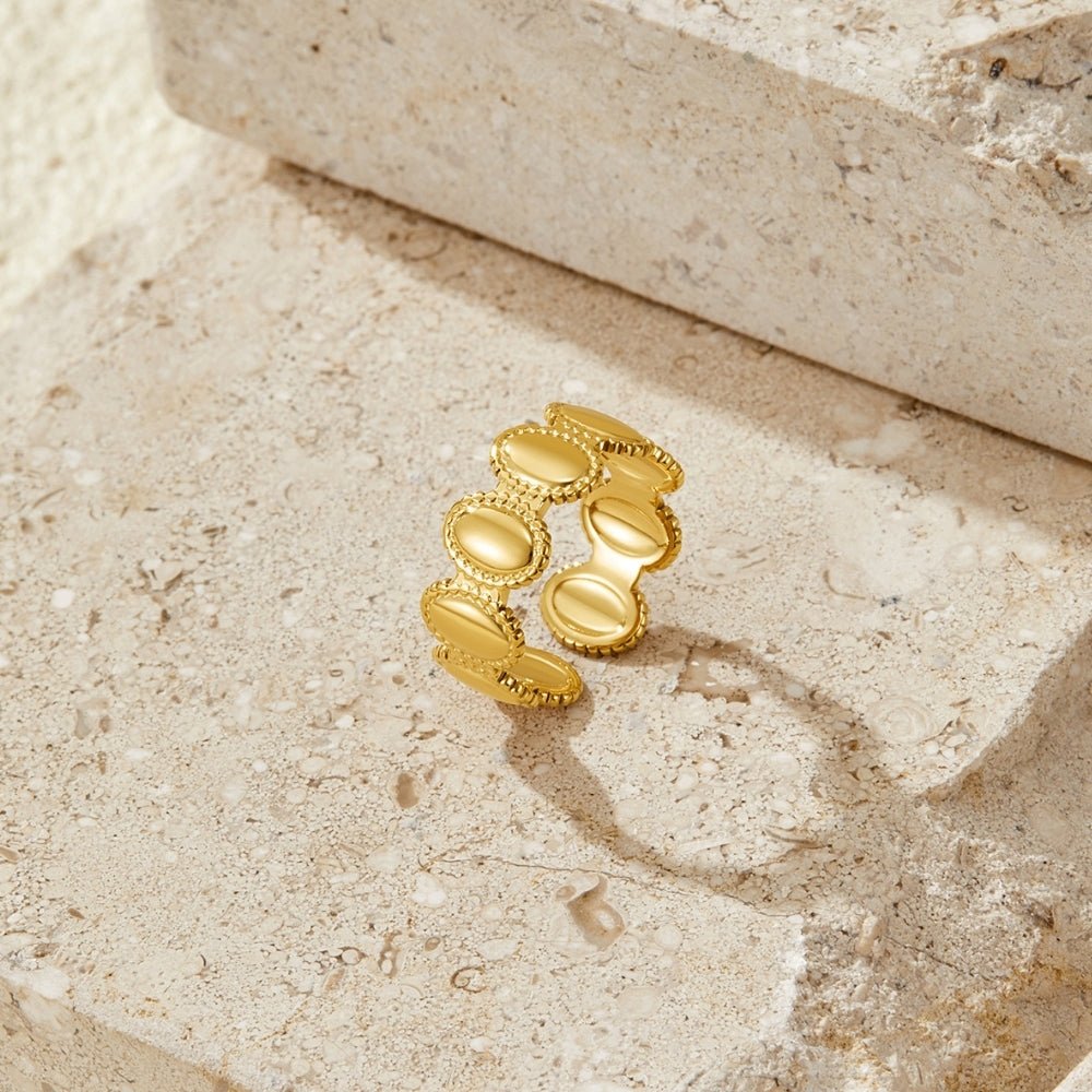 Vintage Athena Gold Ring, open band of gold oval discs on beige stone