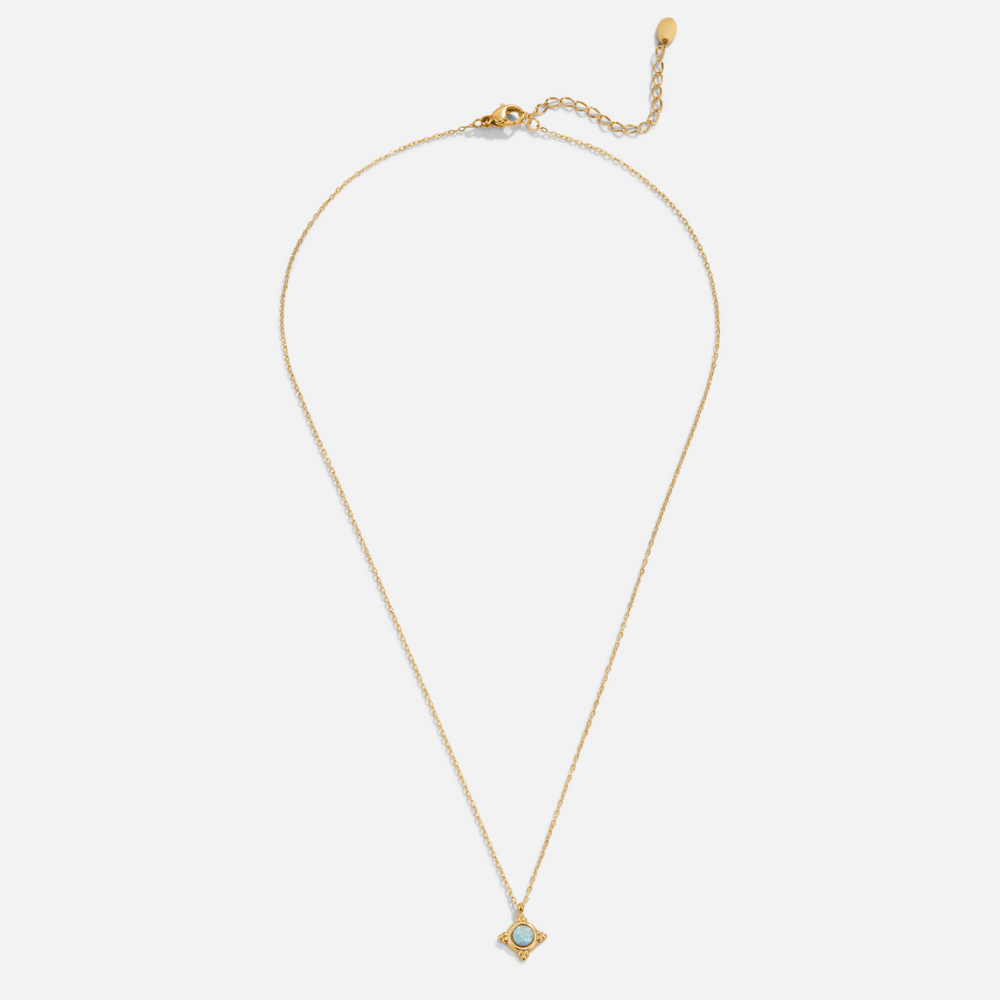 Vintage Blue Opal Pendant Necklace, flat lay of gold chain with light blue stone pendant